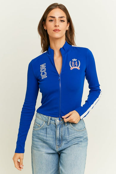 T-shirt bleu à manches longues de TALLY WEIJL, avec fermeture éclair et bandes blanches sur les manches.