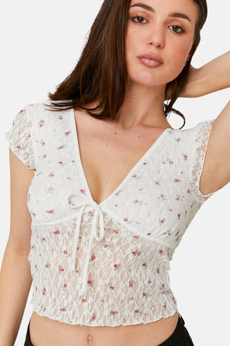 Blouse écru à manches courtes de TALLY WEIJL, avec motif de fleur de rose et détails en dentelle.