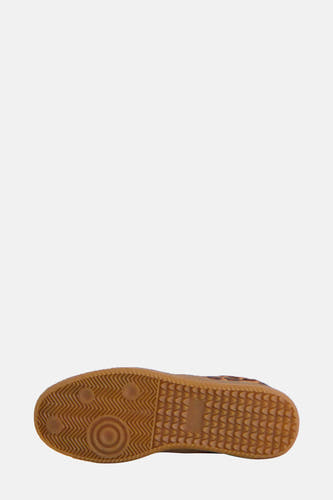 Sneakers brunes de SUPERTRASH, avec une semelle en caoutchouc profilée.