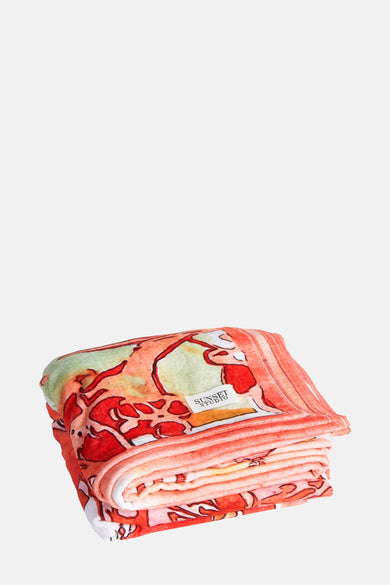 Linge de plage orange SUN SUN SUN SUN avec un motif ab ab ab abquarel sur surposé sur un fond blanc.