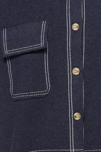 Gilet sans manches bleu ADORE, avec une poche plaquée et fermeture à boutons.