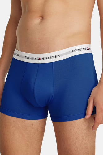 Boxer short en coton bleu de TOMMY JEANS, avec une ceinture blanche et un ajustement près du corps.