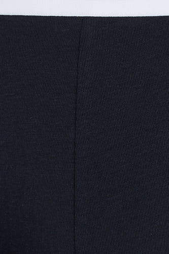 Boxer short bleu de TOMMY JEANS, avec une bande blanche en haut et une fine structure en côtes.