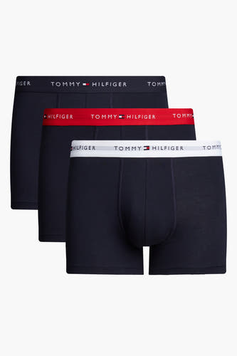 Blauwe boxershort van TOMMY JEANS, met rode en witte taillebanden met merknaam.