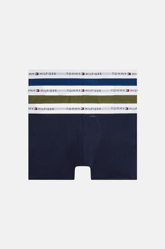Boxer short bleu de TOMMY JEANS, avec une ceinture élastique blanche et le logo de la marque dessus.
