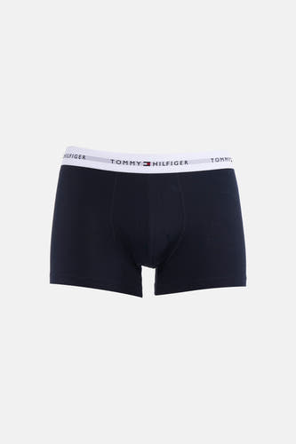 Boxer short bleu foncé de TOMMY JEANS avec une ceinture élastique blanche ornée du logo.
