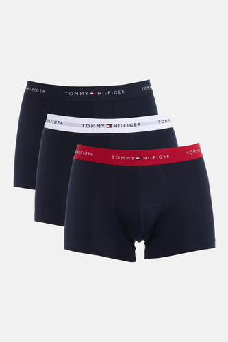 Boxer short bleu foncé de Tommy Jeans avec une ceinture rouge avec logo de la marque.
