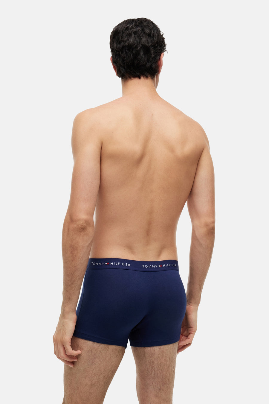 Donkerblauwe boxershort met elastische tailleband van TOMMY JEANS, achterkant weergave, gladde stof, model draagt zonder bovenkleding