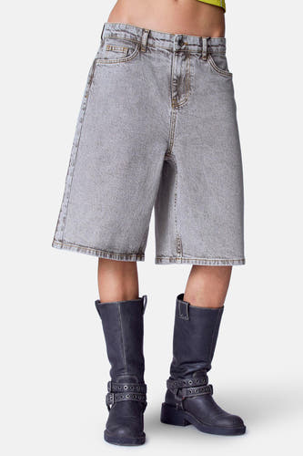 Short mid grey denim pants from Unwind, with dark side stripes and black leather shoes.