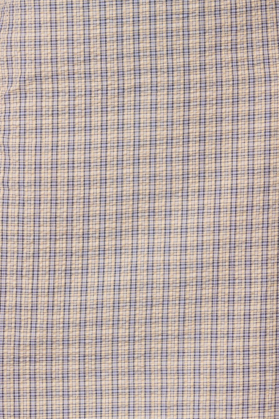 Robe bleue sans manches d'Unwind, avec un motif à carreaux dans des tons de bleu et de beige.