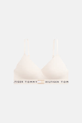 Soutien-gorge beige de TOMMY JEANS avec logo noir sur la bande élastique inférieure et bretelles réglables.