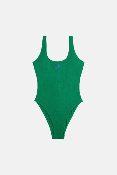 Maillot de bain vert de TOMMY JEANS, avec détails de logo brodés et une surface texturée gaufrée.