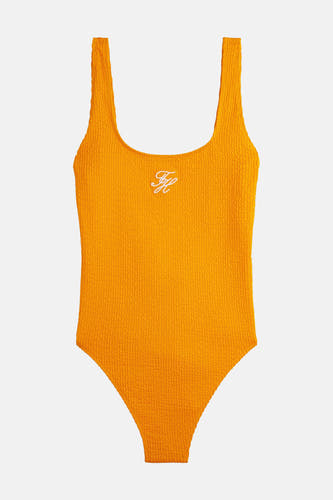 Maillot de bain orange TOMMY JEANS avec matière texturée et logo blanc brodé.