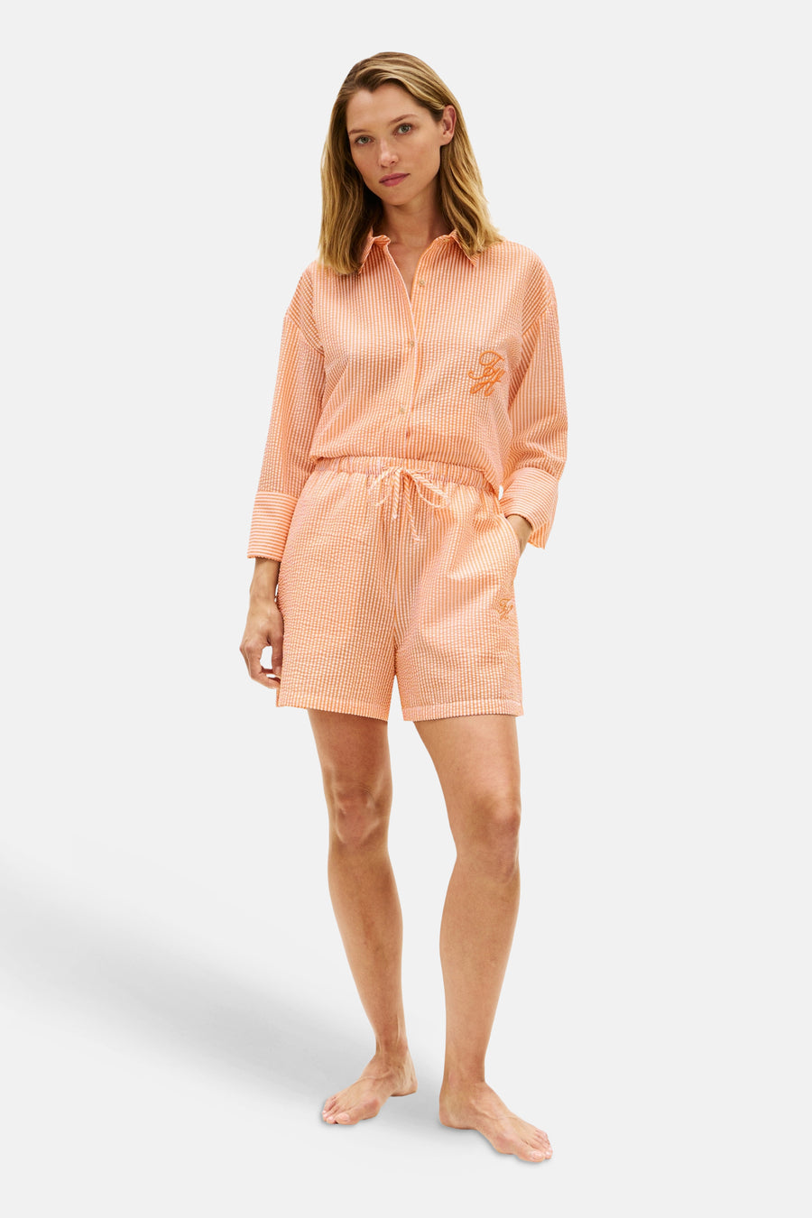 Oranje gestreepte short van TOMMY JEANS met trekkoord en geborduurd logo.