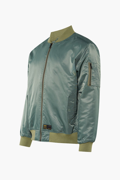Veste courte verte VANS 'OFF THE WALL' en nylon brillant avec poignets côtelés vert olive et poche sur la manche.