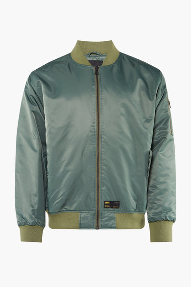Veste courte verte VANS "OFF THE WALL" avec aspect satiné, bords côtelés, fermeture éclair et étiquette de marque.