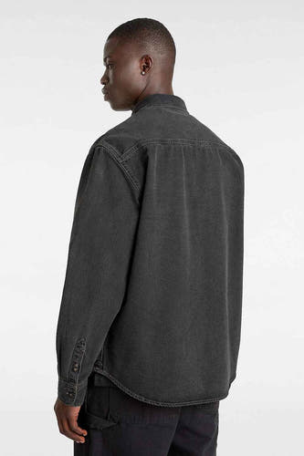 Blouson en denim gris foncé à manches longues de VANS "OFF THE WALL", vu par derrière, avec une fermeture à boutons et un col droit.
