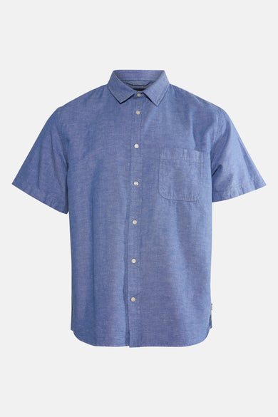 Chemise bleue à manches courtes de VANS "OFF THE WALL", avec col boutonné et poche poitrine.