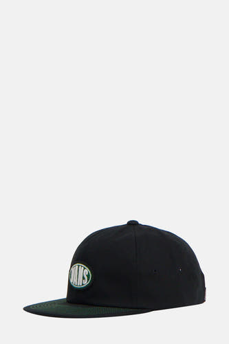 Casquette noire VANS "OFF THE WALL", avec un logo Vans vert et des surpiqûres vertes sur le bord.