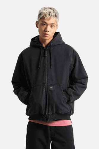 Manteau court noir de VANS "OFF THE WALL", avec capuche et poches à l'avant.