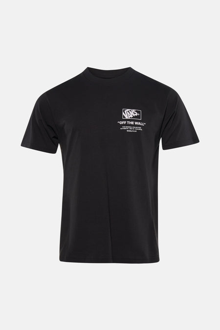 T-shirt noir VANS "OFF THE WALL", porté avec un jean déchiré et des baskets.
