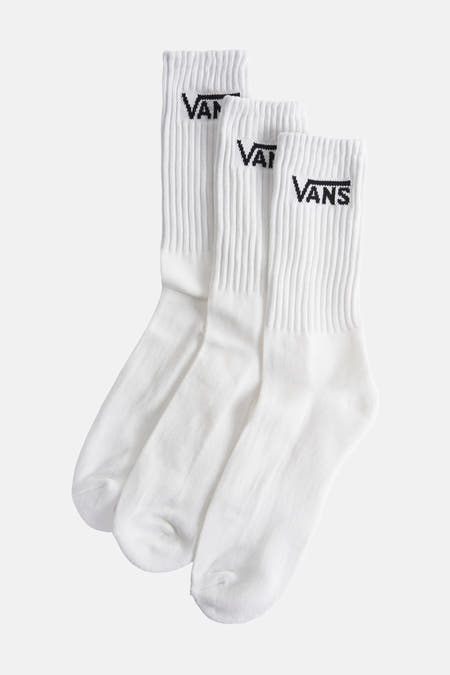 Chaussettes blanches de Vans avec une texture à côtes et un logo noir.
