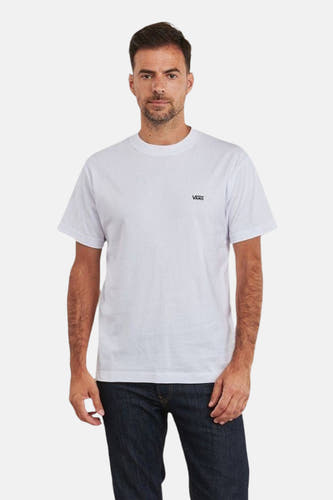 T-shirt blanc à manches courtes de VANS "OFF THE WALL", vu de l'arrière, avec des jeans foncés et des chaussures blanches.