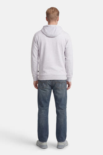 Sweat à capuche gris VANS "OFF THE WALL", vu de dos, combiné avec un jean bleu et des baskets grises.