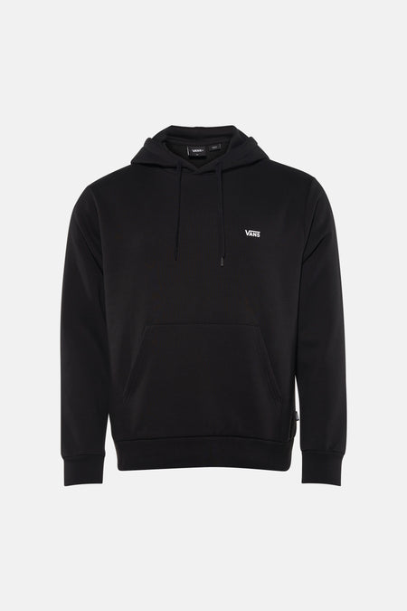 Sweatshirt noir à capuche de VANS, avec cordons de serrage et une poche kangourou à l'avant, combiné avec un jean gris et des baskets basses.