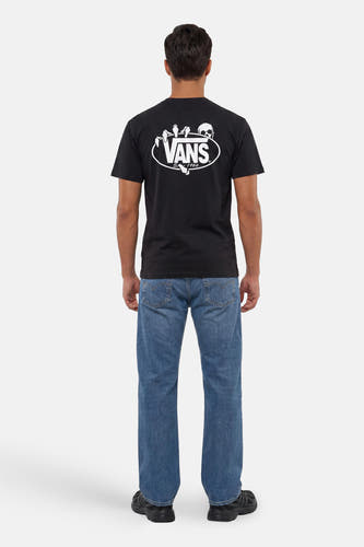 T-shirt noir VANS "OFF THE WALL" avec grand logo blanc et imprimé squelette au dos, porté par un homme en jean bleu.