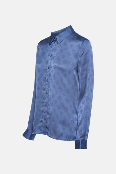 Blouse bleue à longues manches de Guess, avec un motif subtil.