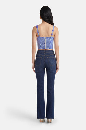 Chemisier rayé bleu de Guess, avec bretelles réglables et une fermeture éclair argentée au dos.