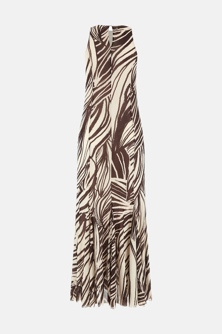 Een lang mouwloos kleedje in bruin en crème van Guess, met abstract streepdessin en halterhals met sleutelgat.