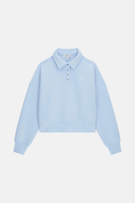Sweat-shirt bleu de Guess, avec col montant et fermeture à boutons, et petit logo sur la poitrine.