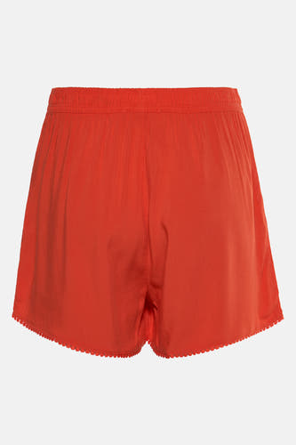 Short orange HAILYS avec une ceinture élastique et un bord tricoté décoratif le long de l'ourlet.