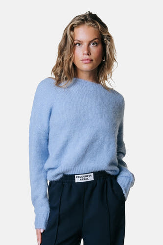 Pull en maille bleu de COLOURFUL REBEL, avec une étiquette de marque.