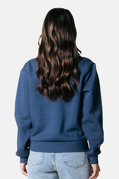 Gilet bleu de COLOURFUL REBEL, avec des manches longues et un col rond, vu de derrière.